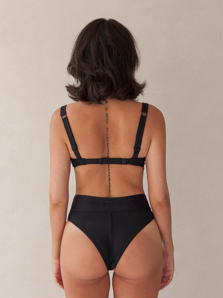 Bikini top balcony underwire and cheeky bikini bottom high-waist in black with rib fabric & embroidery, woman backside